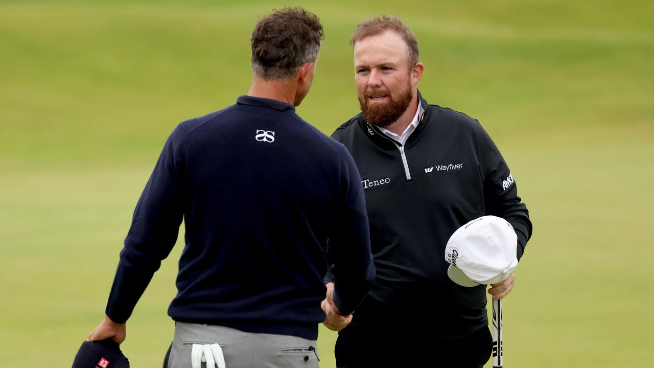 TROON, SCOTLAND - JULY 21: Shane Lowry and Adam Scott after their round.