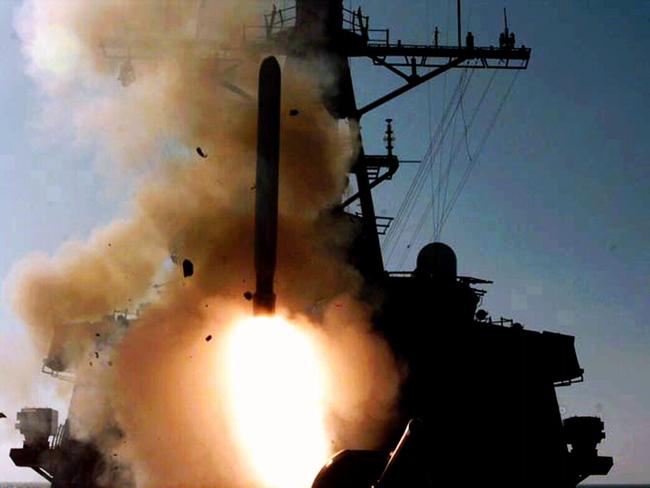 A Tomahawk cruise missile is launched from an Arleigh Burke class destroyer during fourth wave of attacks on Iraq in support of Operation Desert Fox in Persian Gulf, 1998.