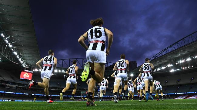 The Magpies run out to an empty Marvel Stadium on March 20. Marvel could host the Grand Final. Picture: Getty