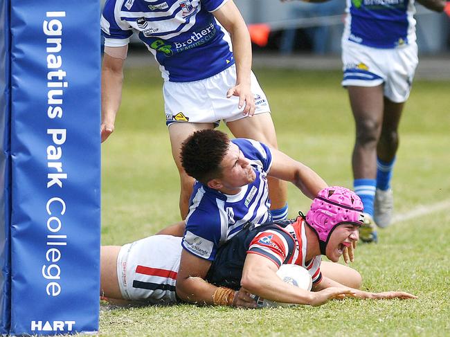 Adam McSherry scores a try against rivals Ignatius Park College in the Aaron Payne Cup. Picture: Shae Beplate.