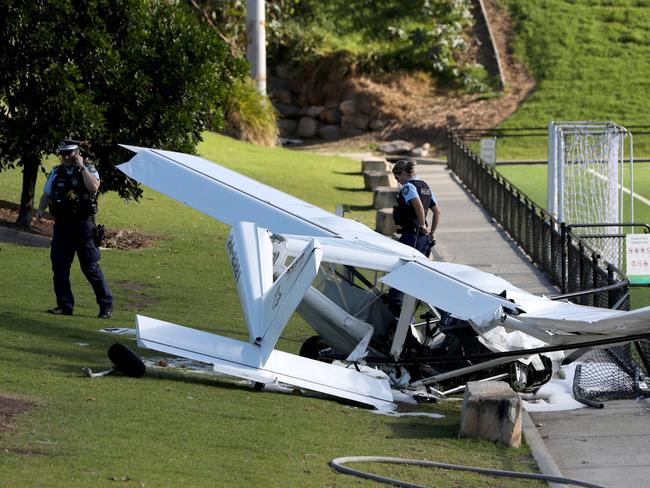 Police assess the wreckage of Horace Ho’s light aircraft. Pic: Damian Shaw