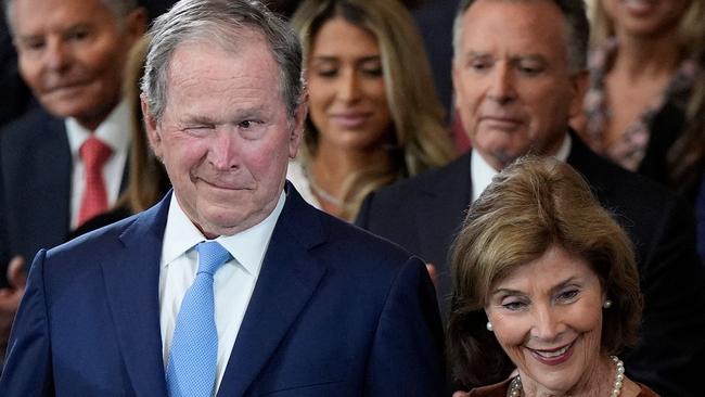 Former president George W. Bush and wife Laura Bush arrive for the inauguration ceremony. Picture: AFP