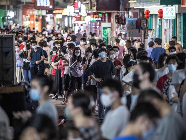 This photo taken on April 28, 2022 shows residents queueing to undergo nucleic acid tests for the Covid-19 coronavirus in Guangzhou, in China's southern Guangdong province. (Photo by AFP) / China OUT