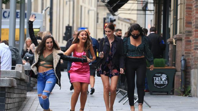 Women head for a night out in Newcastle on Saturday. Picture: AFP