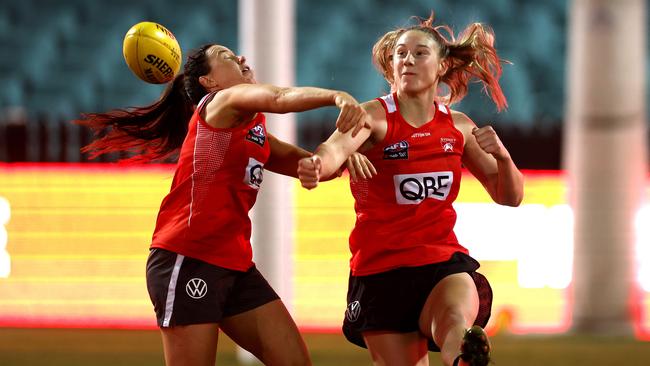 Montana Ham (right) and Brooke Lochland battle it out at the AFLW Swans’ first training session on the SCG. Picture: Phil Hillyard