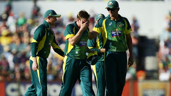 PERTH, AUSTRALIA - FEBRUARY 01: James Faulkner of Australia is consoled by teamates as he leaves the field injured during the final match of the Carlton Mid One Day International series between Australia and England at WACA on February 1, 2015 in Perth, Australia. (Photo by Matt King/Getty Images)