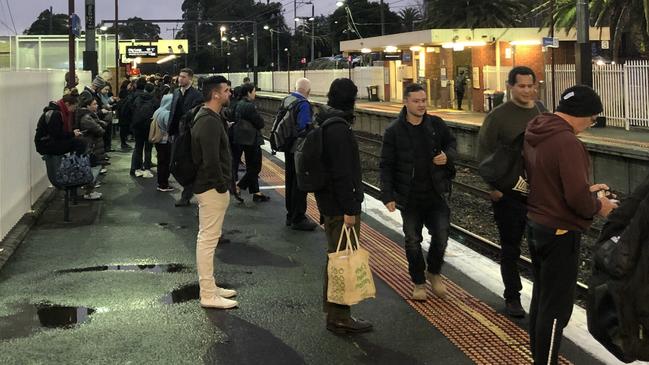 Commuters at Blackburn station on the platform await further instructions after disruptions to their morning service.Picture: Supplied.