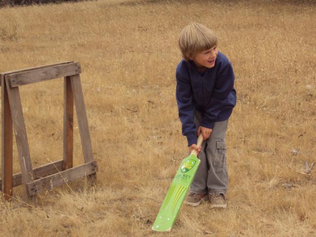 A young Johnny Furphy plays backyard cricket. Picture: Supplied