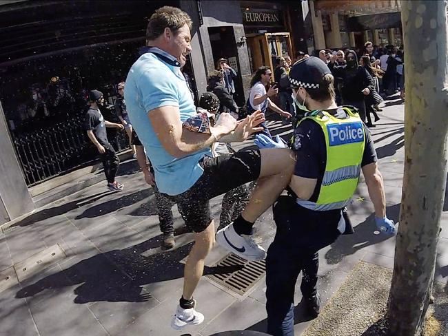 A police officer is attacked during an anti-lockdown protest in 2021. Picture: Jason Edwards