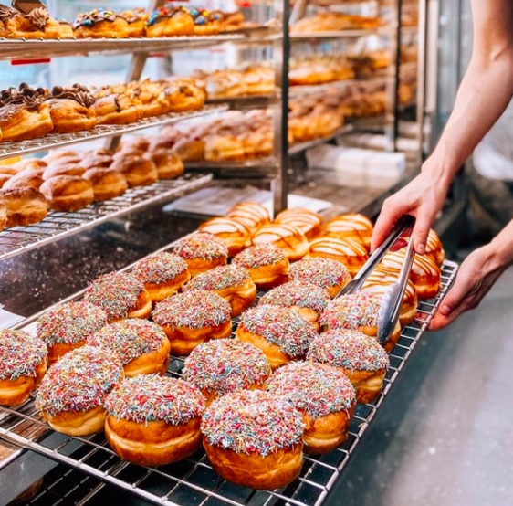 Forget driving to Kenilworth and Eat Street- there’s a new player on the deluxe doughnut scene serving up Insta-worthy delights in our own backyard.