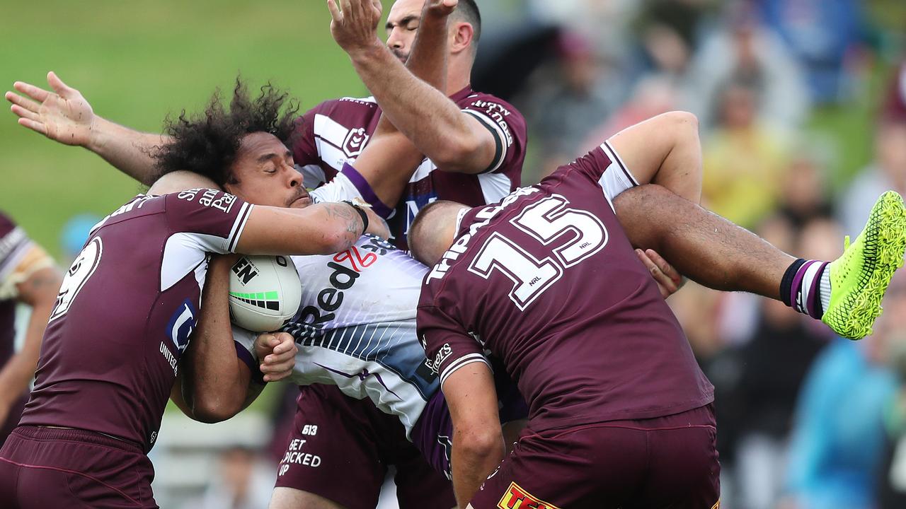 Melbourne's Felise Kaufusi feels the force of the Manly defence. Picture: Brett Costello