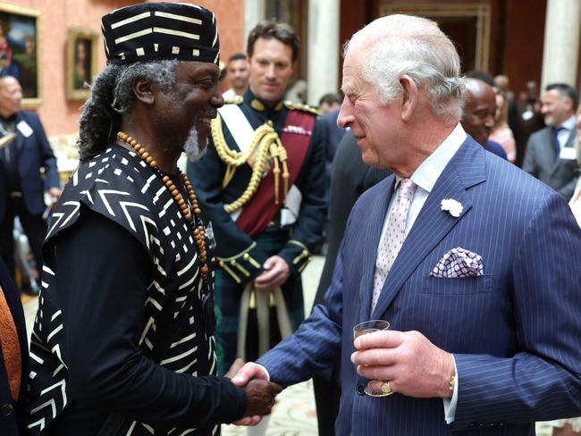 King Charles III talks to guests during a reception to celebrate the Windrush Generation and mark the 75th anniversary of the arrival of the HMT Empire Windrush, at Buckingham Palace, in London on Wednesday. Picture: AFP