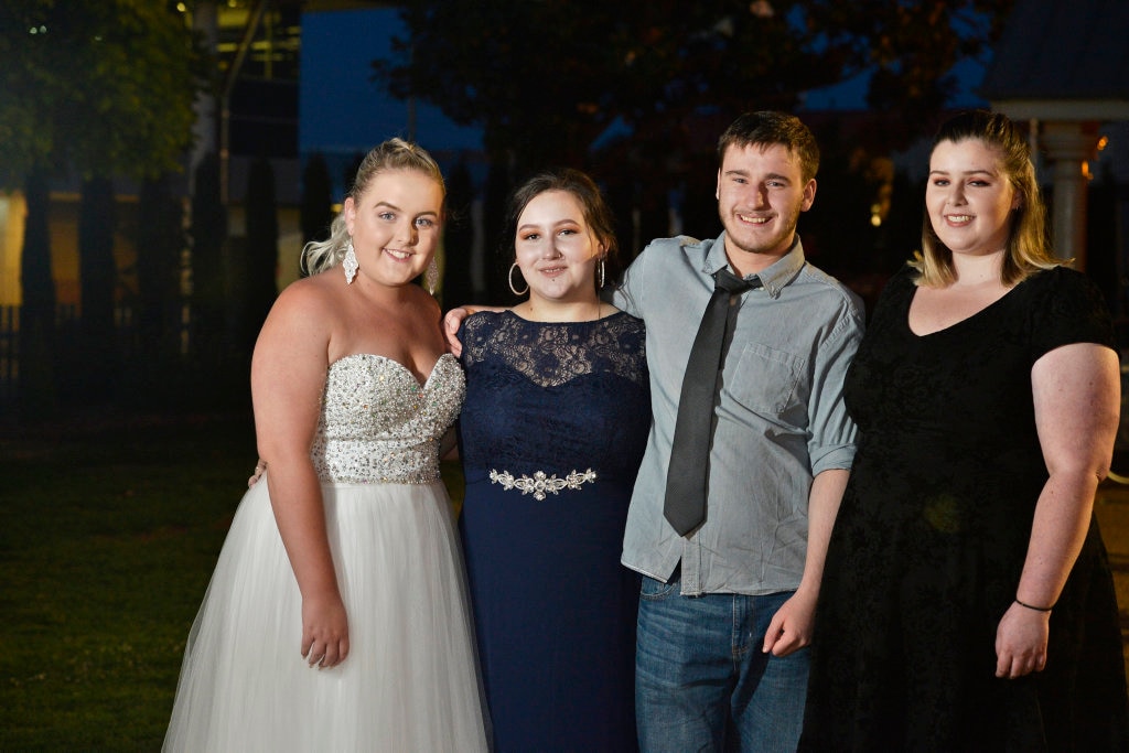 Graduates (from left) Jessica Halliday, Sarah Williams and Oscar Mackie with Miranda Coulson at Toowoomba Flexi School formal at Empire Theatres, Thursday, November 9, 2017. Picture: Kevin Farmer