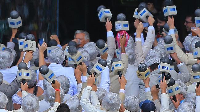 Bob Hawke skolls a beer in the Ritchie Benaud lookalike section during day 2 of the fifth Ashes Test between Australia and England at the SCG in 2014. Picture: Mark Evans