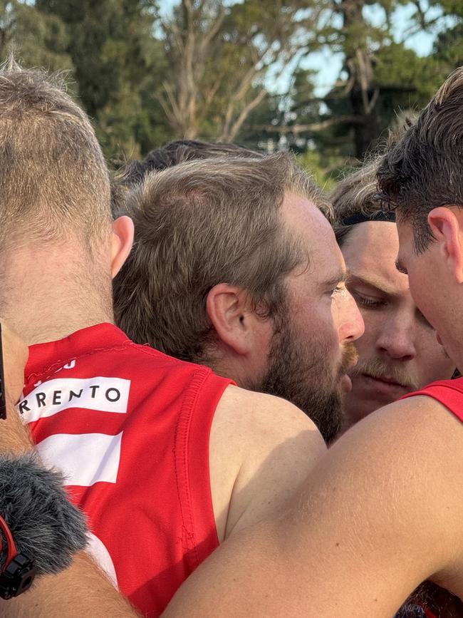 Leigh Poholke addresses his players.