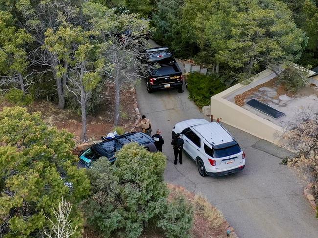 Santa Fe County deputies remain outside the house belonging to actor Gene Hackman and his wife Betsy Arakawa were earlier found dead in Santa Fe. Picture: AP Photo/Roberto E. Rosales