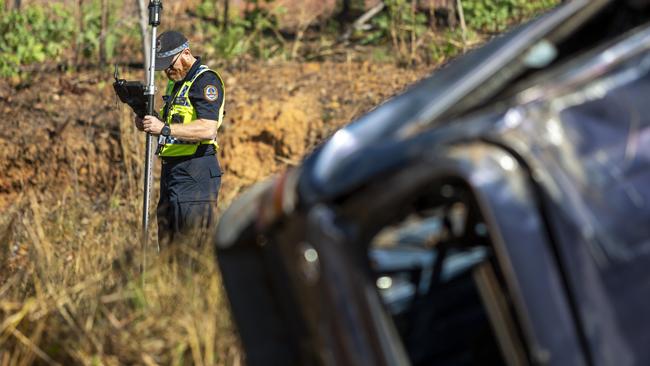 NT Police mark out the scene of the fatal crash on the Stuart Hwy at Manton Dam. Picture: Floss Adams.