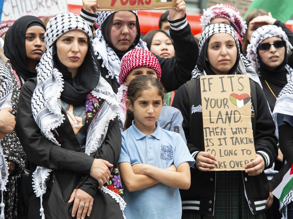 Placards on display at the protest. Picture: NCA NewsWire / Monique Harmer