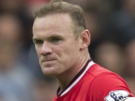 Manchester United players including captain Wayne Rooney, centre right, wait for play to resume after Swansea City's second goal during their English Premier League soccer match at Old Trafford Stadium, Manchester, England, Saturday, Aug. 16, 2014. (AP Photo/Jon Super)