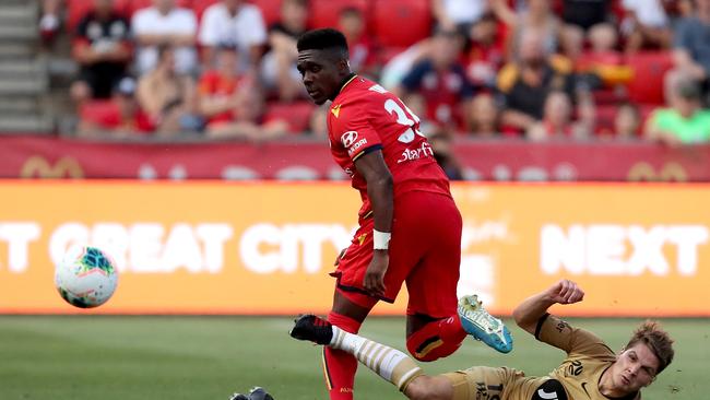 Adelaide United’s Al Hassan Toure tackled by Western Sydney’s Pirmin Schwegler at Coopers Stadium. (AAP Image/James Elsby)