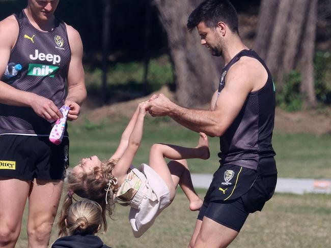 Richmond training on the Gold Coast. 14/07/2020.  Trent Cotchin with his oldest daughter Harper as wife Brooke  looks on at training today   . Pic: Michael Klein