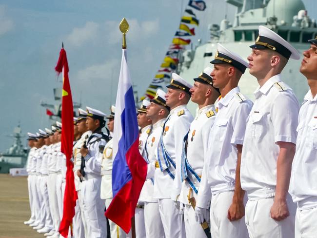 A grab taken from a handout footage released by the Russian Defence Ministry on July 15, 2024, shows Russian and Chinese sailors taking part in the opening ceremony of a joint maritime exercises at a port in Zhanjiang in China's southern Guangdong province. (Photo by Handout / Russian Defence Ministry / AFP) / RESTRICTED TO EDITORIAL USE - MANDATORY CREDIT "AFP PHOTO / Russian Defence Ministry" - NO MARKETING NO ADVERTISING CAMPAIGNS - DISTRIBUTED AS A SERVICE TO CLIENTS