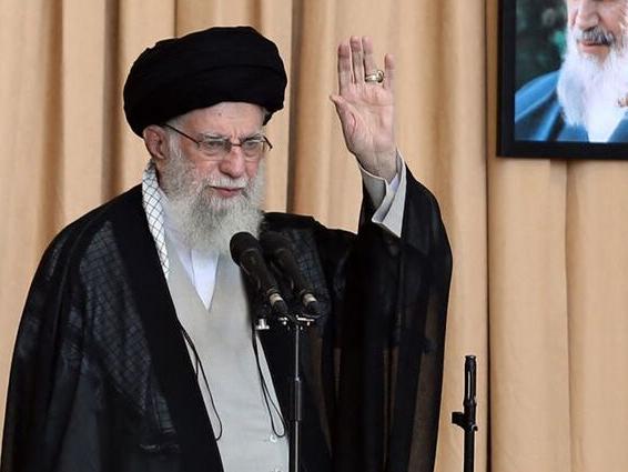 The Iranian Supreme Leader Ali Khamenei brandished a rifle in his first sermon in almost five years. Picture: AFP