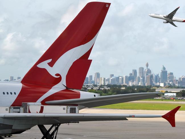 "Sydney, Australia - March, 14th 2012: Quantas aeroplanes and tail fin with the distant view of downtown Sydney - Sydney Airport". Picture: iStock