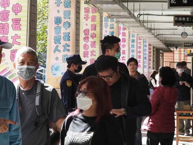 People wait in line to cast their ballots in New Taipei City on January 13, 2024. Picture: Sam Yeh / AFP