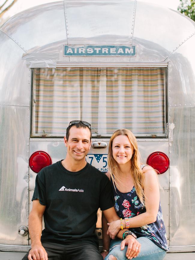 Scott and Jessie Curtis-Griffiths outside one of their beloved Airstreams. Picture: andrewnorthover.com.au