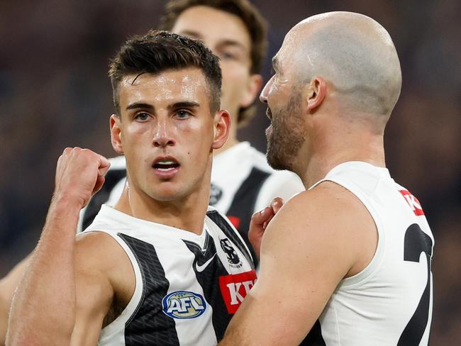 MELBOURNE, AUSTRALIA - MAY 03: Nick Daicos of the Magpies celebrates a goal with teammate Steele Sidebottom during the 2024 AFL Round 08 match between the Carlton Blues and the Collingwood Magpies at The Melbourne Cricket Ground on May 03, 2024 in Melbourne, Australia. (Photo by Dylan Burns/AFL Photos via Getty Images)