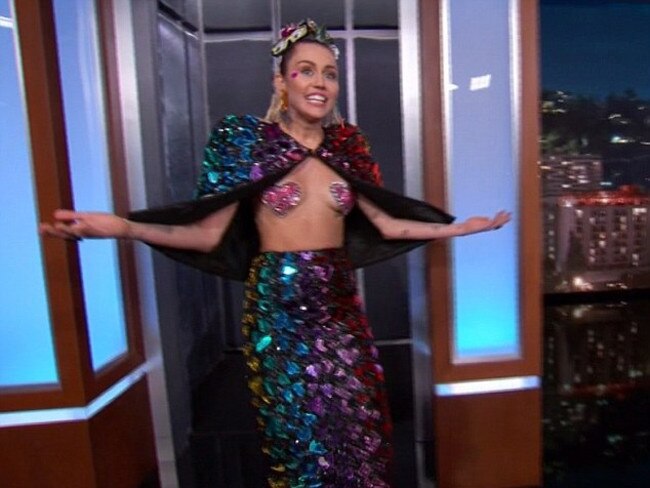 Miley Cyrus tries to ensures she is in the public spotlight before she hosts the MTV Video Music Awards on Monday as she walks on to Jimmy Kimmel Live. Picture: Jimmy Kimmel Live / ABC