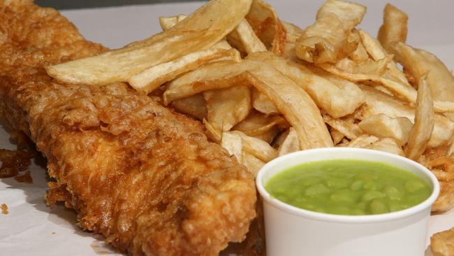 The Great British Fryer’s battered North Atlantic salmon with Mushy Peas direct from the UK and home cut chips. Picture by Scott Fletcher