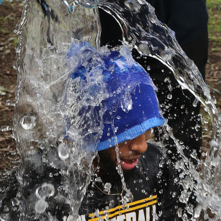 A Victorian junior basketballer gets an off-court bucket. Picture: Stuart Milligan