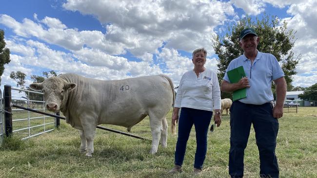 Kenmere Charolais principal Ann-Marie Collins, Holbrook, NSW, and buyer Frank Hill from Derrinal who paid $20,000 for the top price bull.