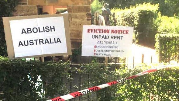 Far-left activists have put up signs at the historic Cooks' Cottage in inner east Melbourne. Picture: Facebook