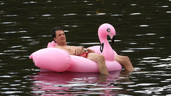 Might as well stay there for the night: A man cools off At Lake Parramatta today. Picture:AAP/Dan Himbrechts