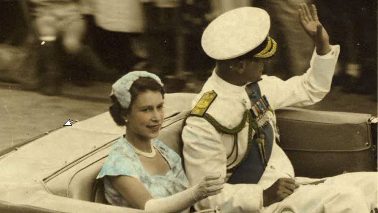 Queen Elizabeth II and Prince Philip, Duke of Edinburgh, driving through the streets of Brisbane during their 1954 Australian tour. Picture: Ray Lewty