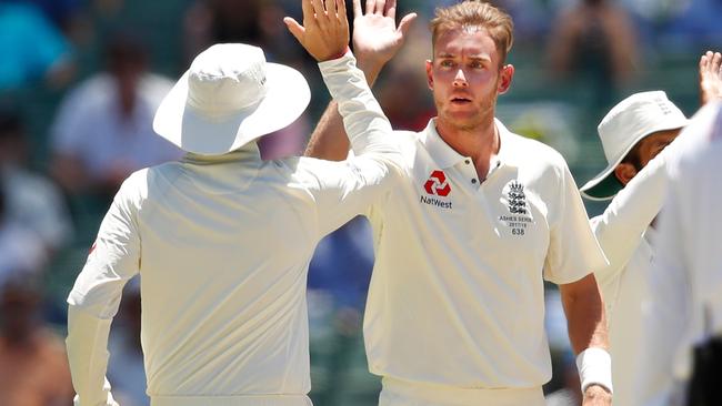 Stuart Broad congratulated by his teammates after dismissing Pat Cummins. Picture: Getty Images.