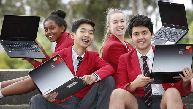 Auburn High School year 9 students Yomiyu 14, Thomas 15, Amy 15 and Alexi 15 who did their NAPLAN test online, celebrate their results. Picture: David Caird