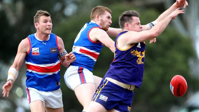 Jake Best of Vermont contests with Josh Allison and Dale Walker of South Croydon. Picture: Hamish Blair