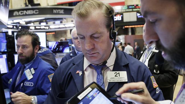 Traders monitor stock prices at the New York Stock Exchange, Friday, Jan. 15, 2016. U.S. stocks plunged again on Friday, completing the worst two-week start to a year ever. (AP Photo/Mark Lennihan)