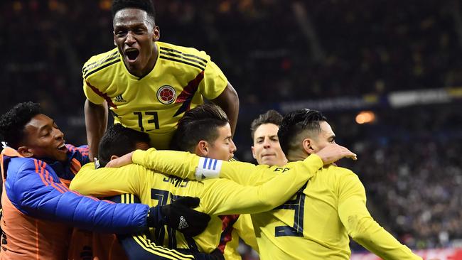 Colombia's forward Radamel Falcao celebrates with teammates.