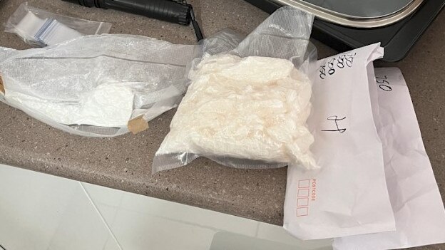 Police seized drugs, cash, and weapons in the raids at Surfers Paradise and Biggera Waters. Picture: QPS