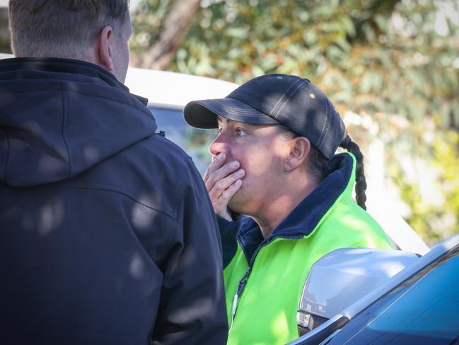 Shocked onlookers at the scene on Monday. Picture: David Caird