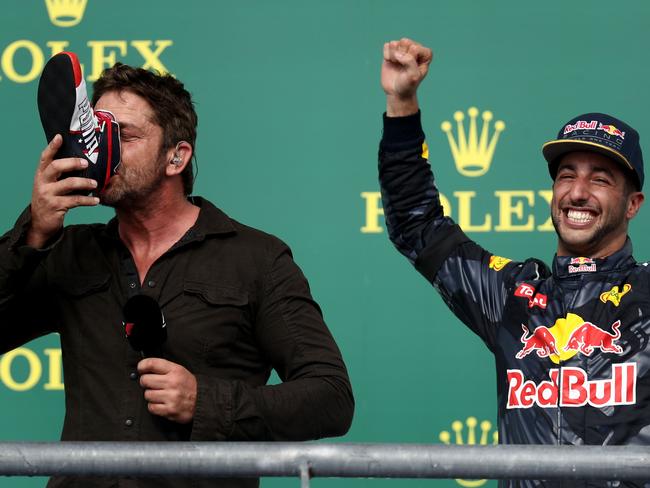 Actor Gerard Butler succumbed to Ricciardo’s shoey demands. Picture: Getty