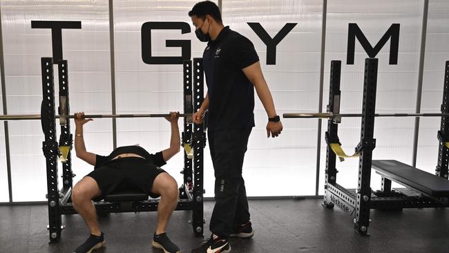 A fitness instructor and his client at a gym in Seoul. Picture: AFP