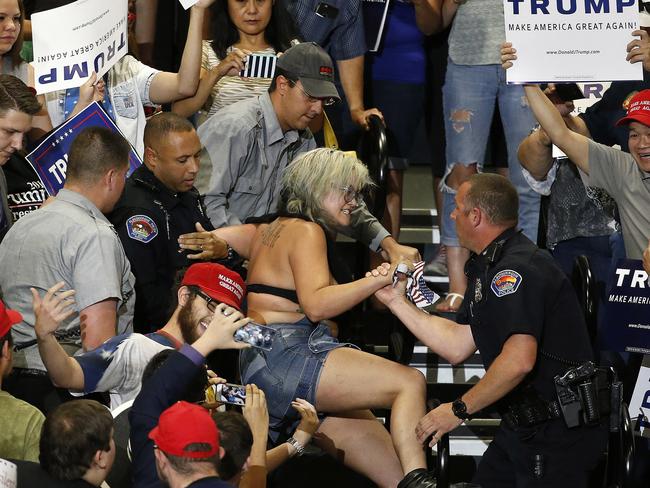 A protester is removed during a speech by Donald Trump. Picture: Brennan Linsley