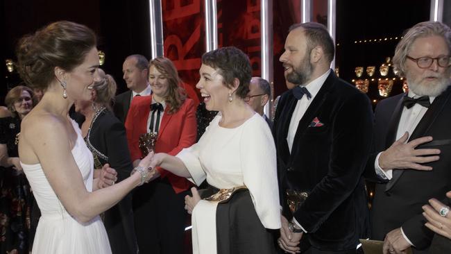 Kate, Duchess of Cambridge meets Olivia Colman, and director Yorgas Lanthimos, 2nd right, and writer Tony McNamara. Picture: AP