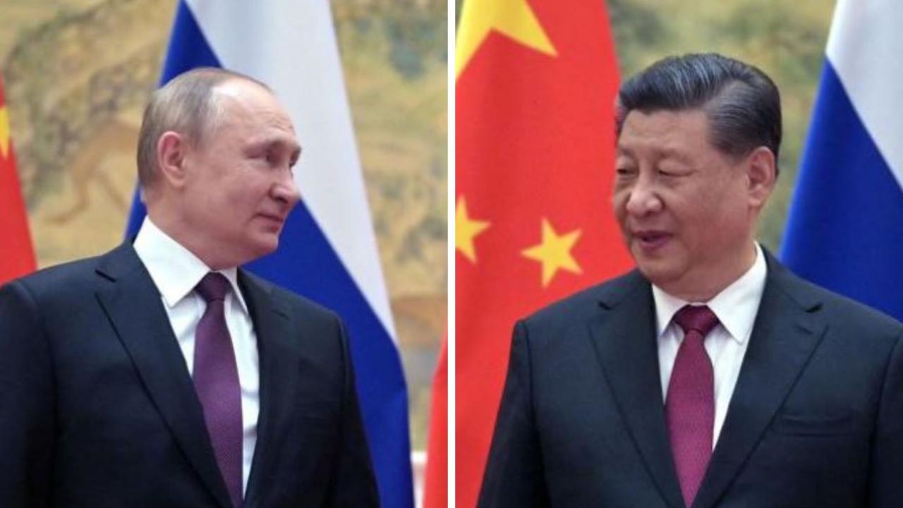 Russian President Vladimir Putin (L) and Chinese President Xi Jinping pose for a photograph during their meeting in Beijing, on February 4, 2022. (Photo by Alexei Druzhinin / Sputnik / AFP)